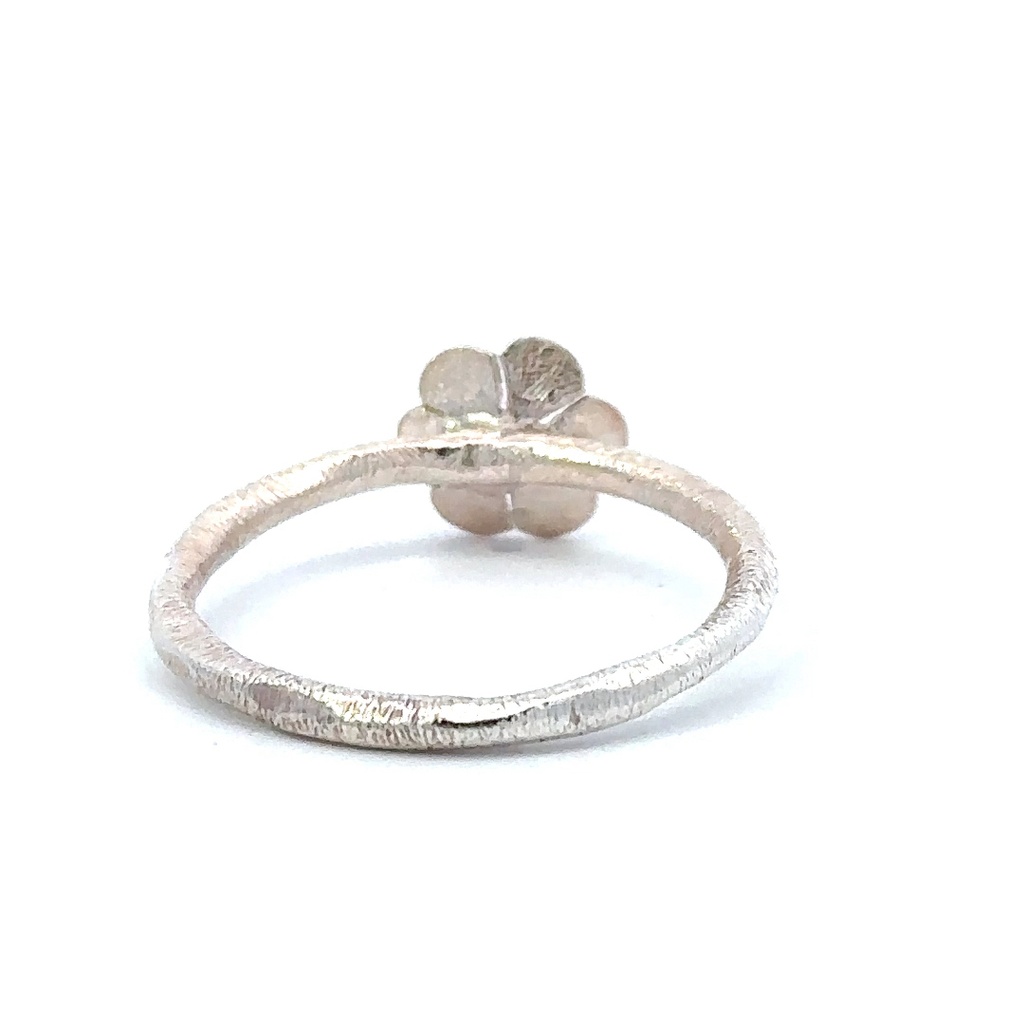 Flower ring with a beaten finish in sterling silver