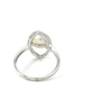 Freshwater pearl ring sitting in a marquise frame