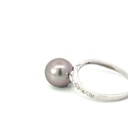 Sterling silver ring with a Tahitian pearl & diamond band that twists up to the setting