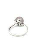 Sterling silver ring with a Tahitian pearl & diamond band that twists up to the setting