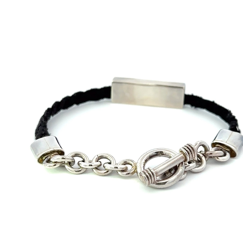Silver bar on black cord bracelet