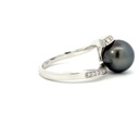 Tahitian pearl with a wavy diamond set band in 18K