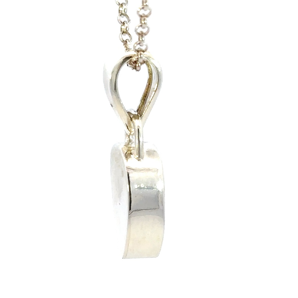 Vibrant blue opal set in a sterling silver pendant