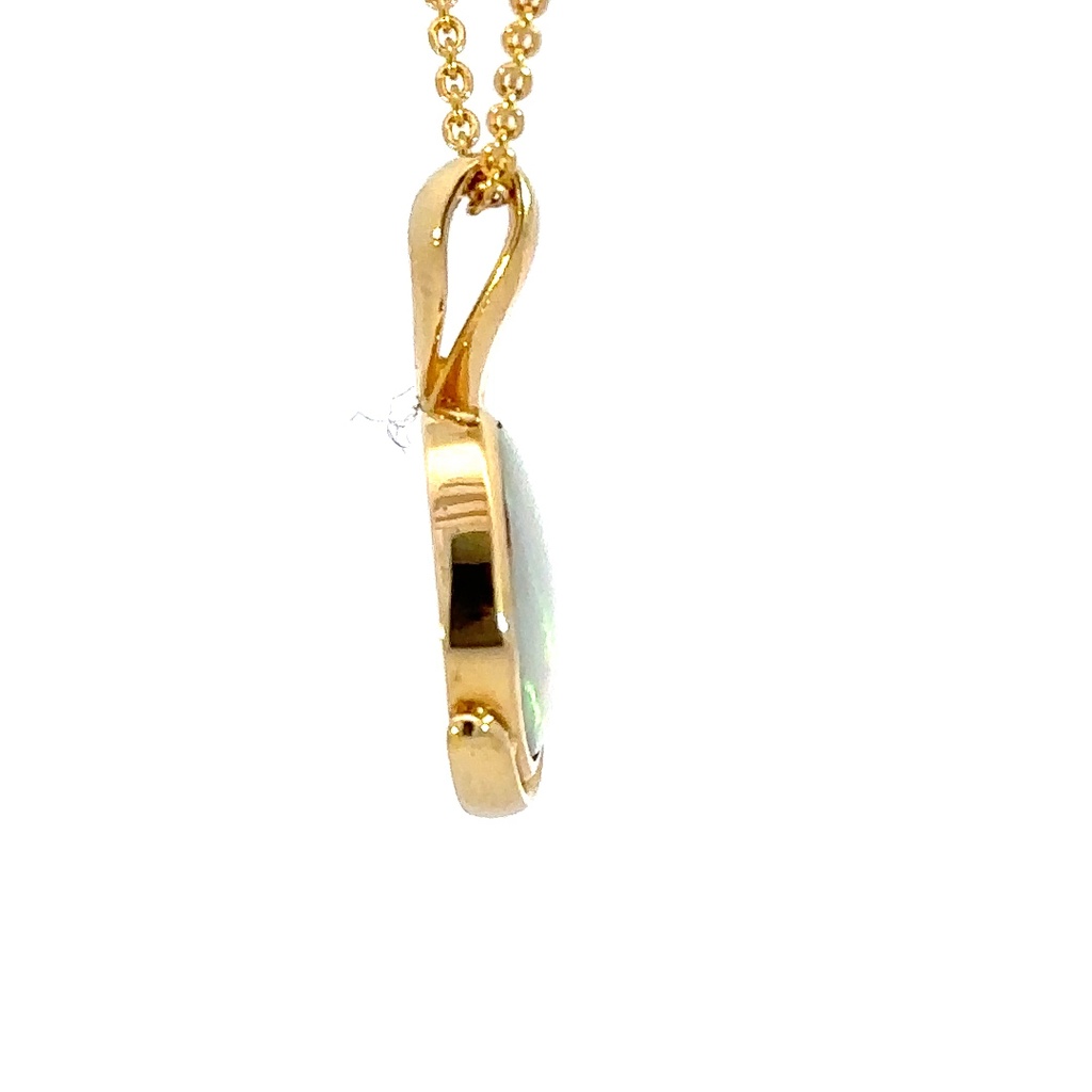 Solid crystal Australian opal pendant set in 18K yellow gold