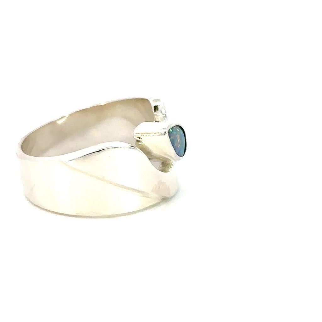 Wide sterling silver ring set with a pear shaped opal