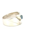 Wide sterling silver ring set with a pear shaped opal