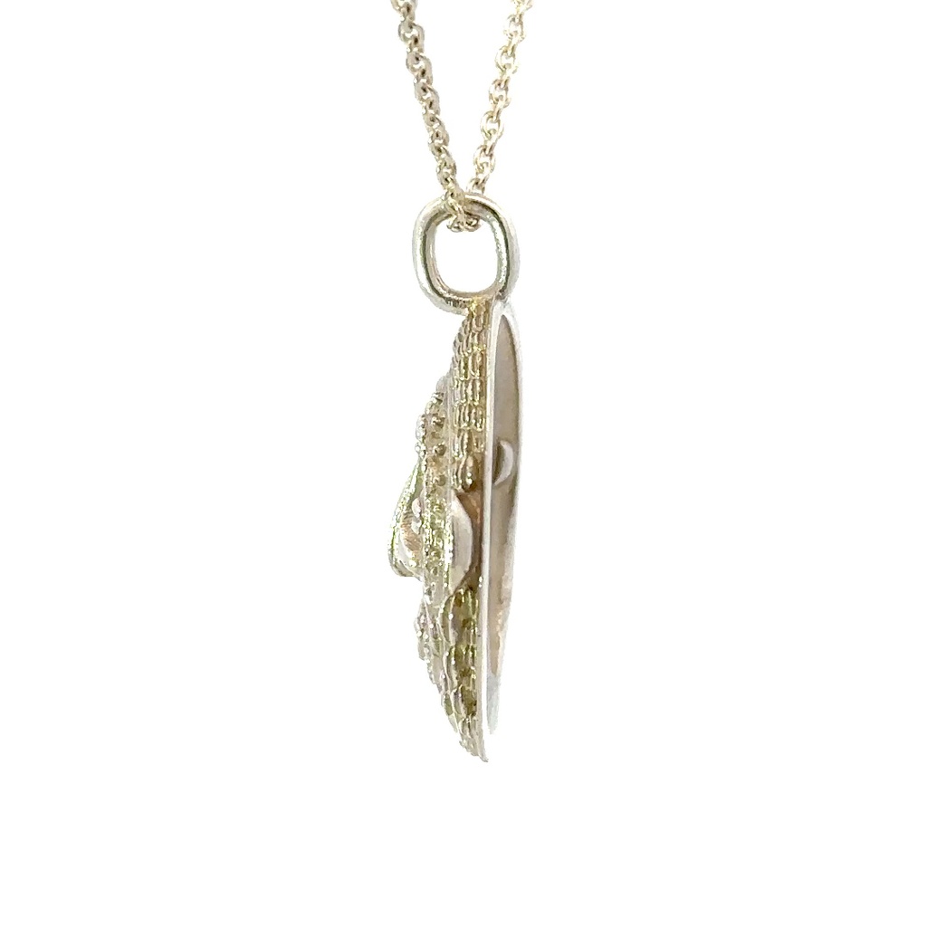 Tribal inspired mud mask pendant with shell details