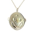 Tribal inspired mud mask pendant with shell details
