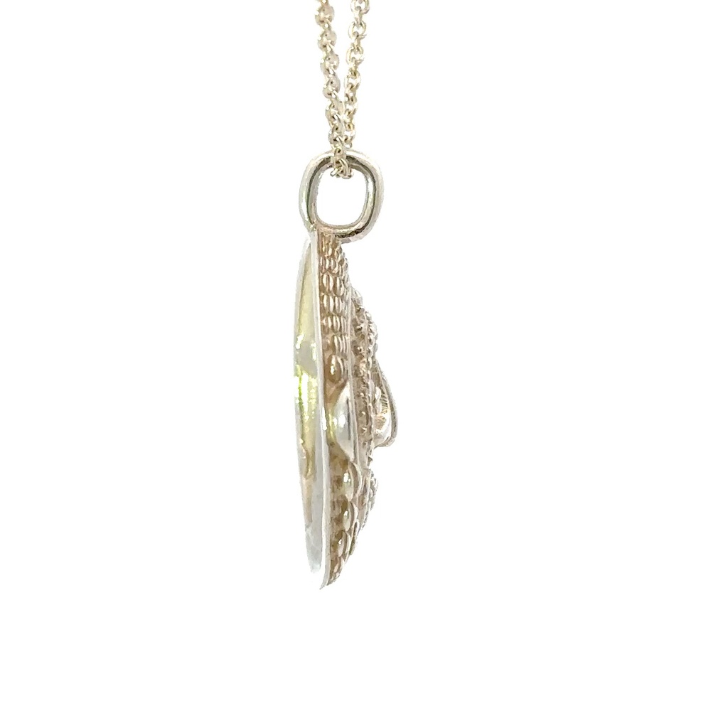 Tribal inspired mud mask pendant with shell details