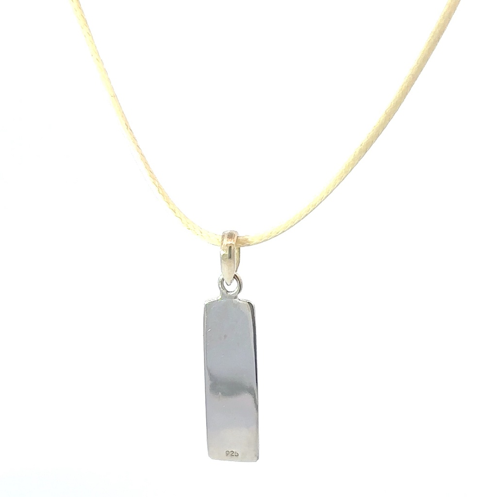 Pendant Tag With "Possibility" Engraved On It On Cream Cord