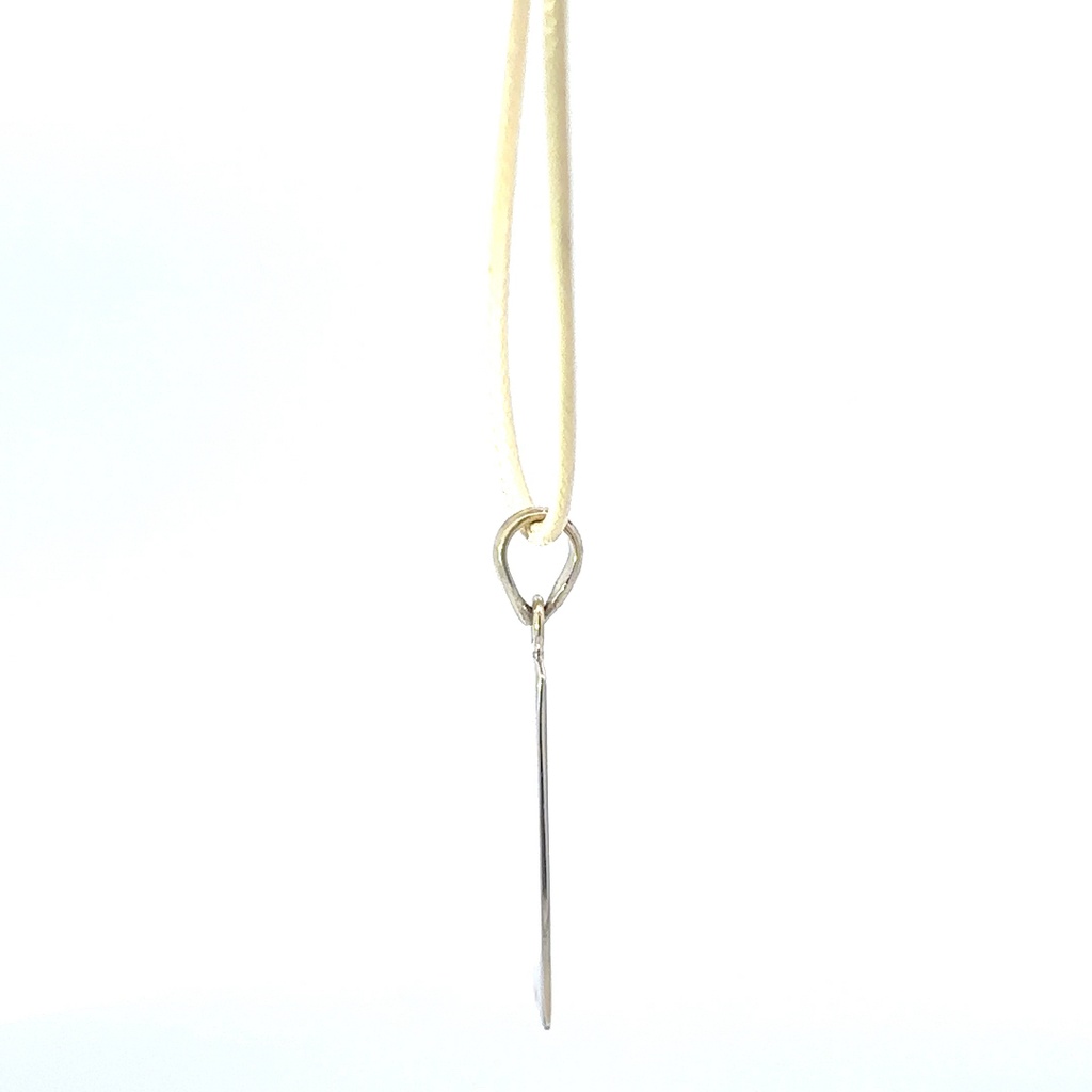 Pendant Tag With "Possibility" Engraved On It On Cream Cord