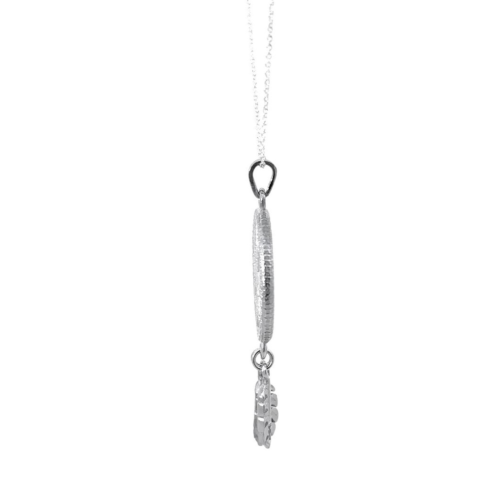 Woven Starburst Pendant In Silver With Leaf Tassel