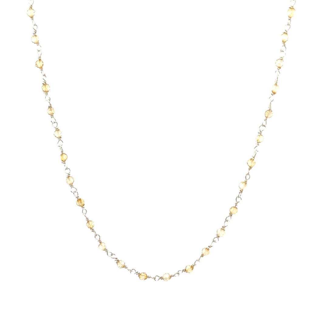 Citrine Beads Spaced On A Sterling Silver Necklace