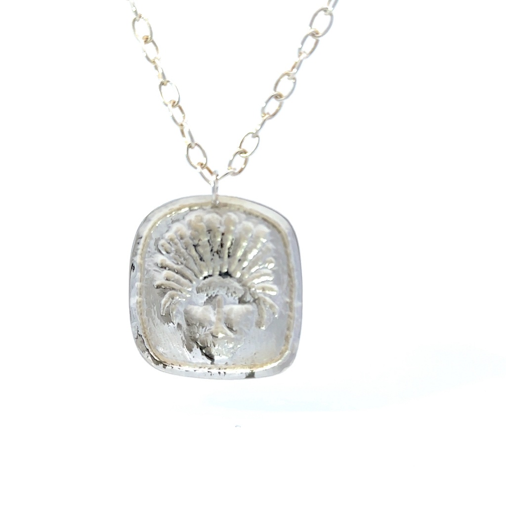 Repousse crafted PNG mask Pendant Sterling Silver